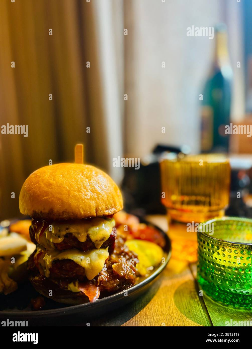 A Double cheesburger at the Trinity Restaurant and Cocktail House in Vilnius, Lithuania. - Smartphone Captured Stock Image