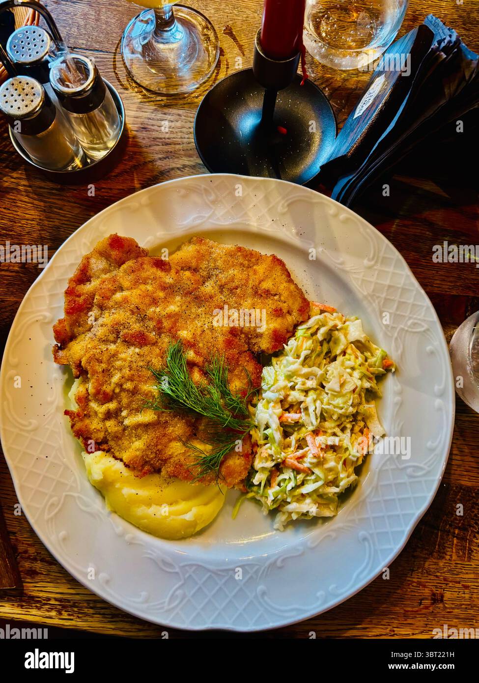 Chicken Schnitzel on Mashed Potatoes with coleslaw. - Smartphone Captured Stock Image