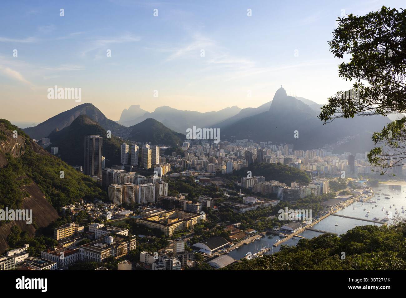 Aerial view of the city's buildings sprawling towards the coast ...