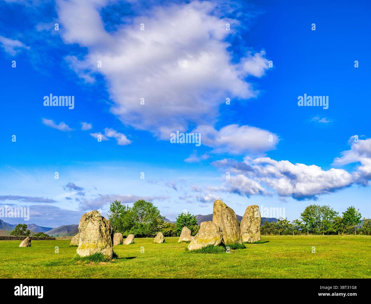 Castlerigg Stone Circle, Lake District, Keswick, Cumbria, on a summer morning, with a blue sky and huge, dramatic white cloud. Stock Photo