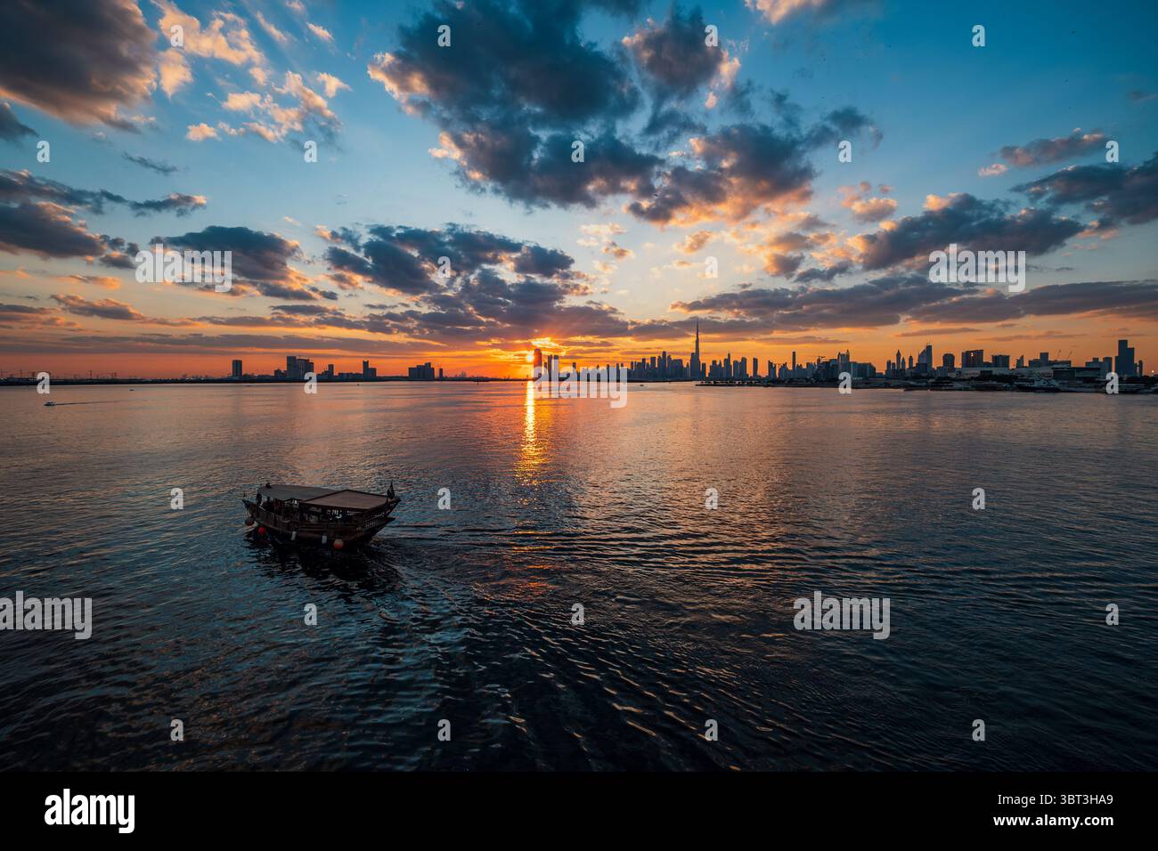 Dubai Downtown skyline day to night with Burj Khalifa and other towers panoramic view from creek harbor, United Arab Emirates. Modern architecture bui Stock Photo