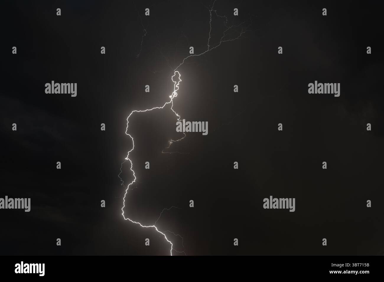 Dark clouds gather as lightning strikes illuminate the night over ...