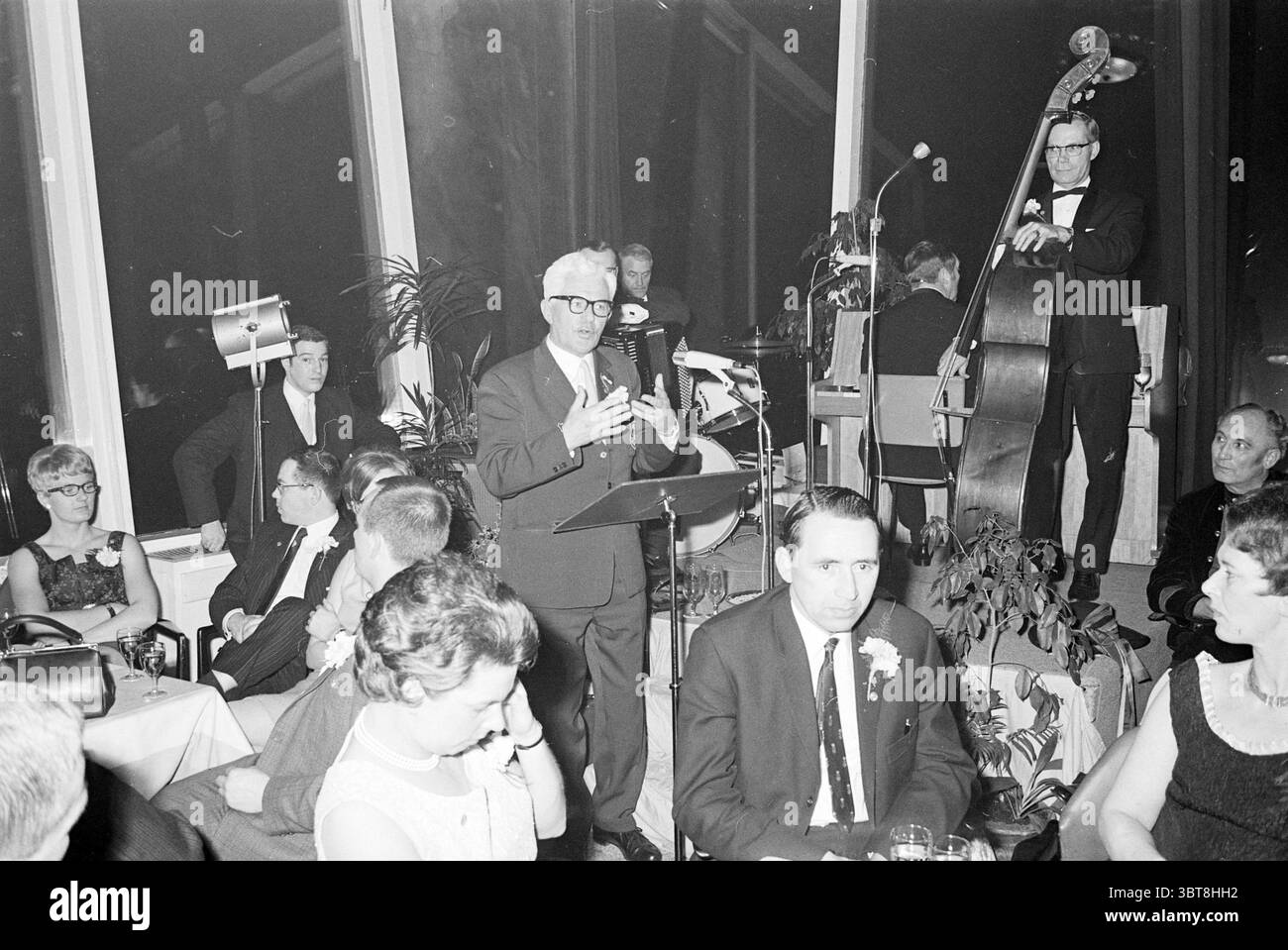 Man welcoming guests Black and White Stock Photos & Images - Alamy