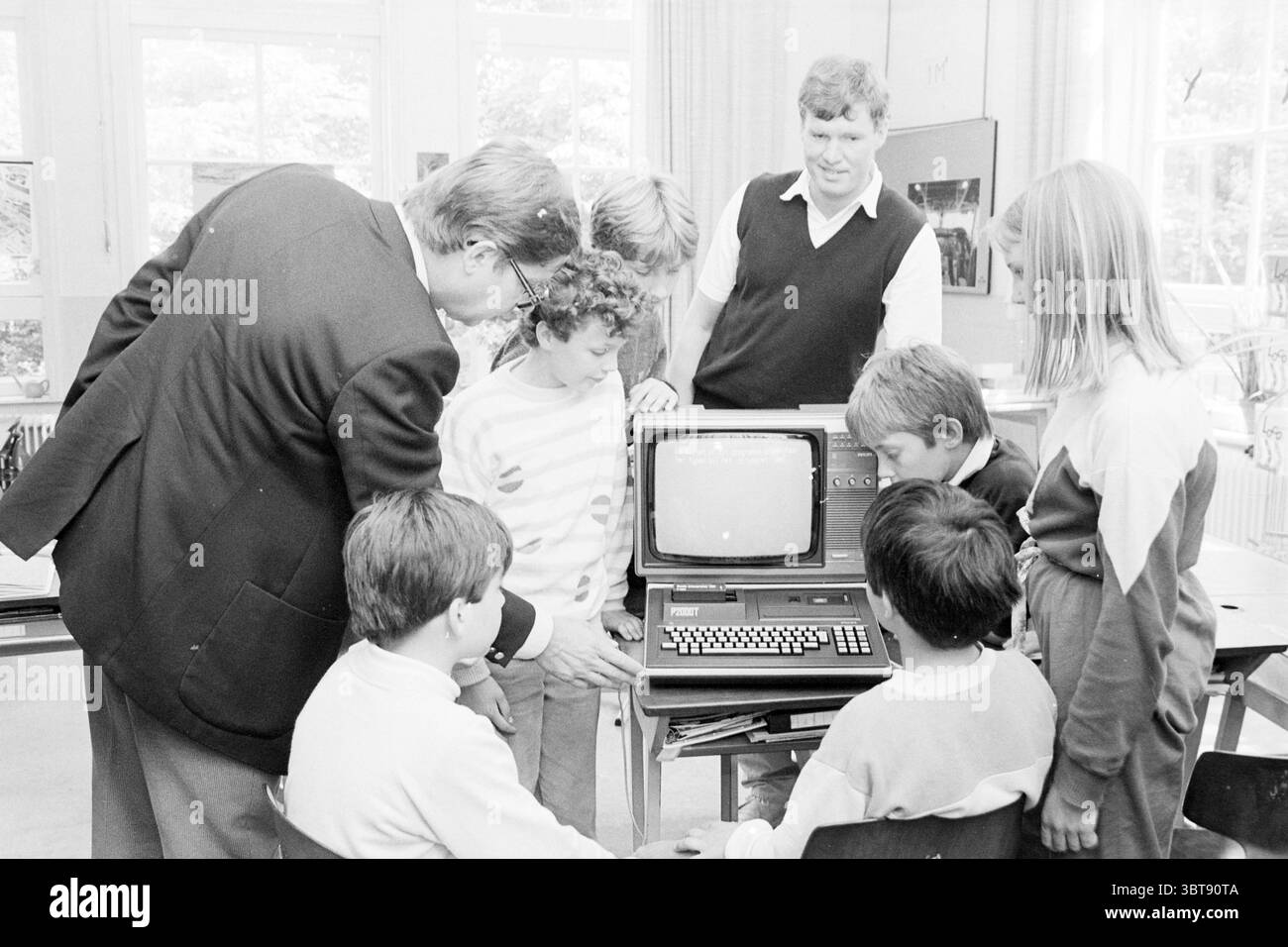 Children classroom computers share Black and White Stock Photos ...