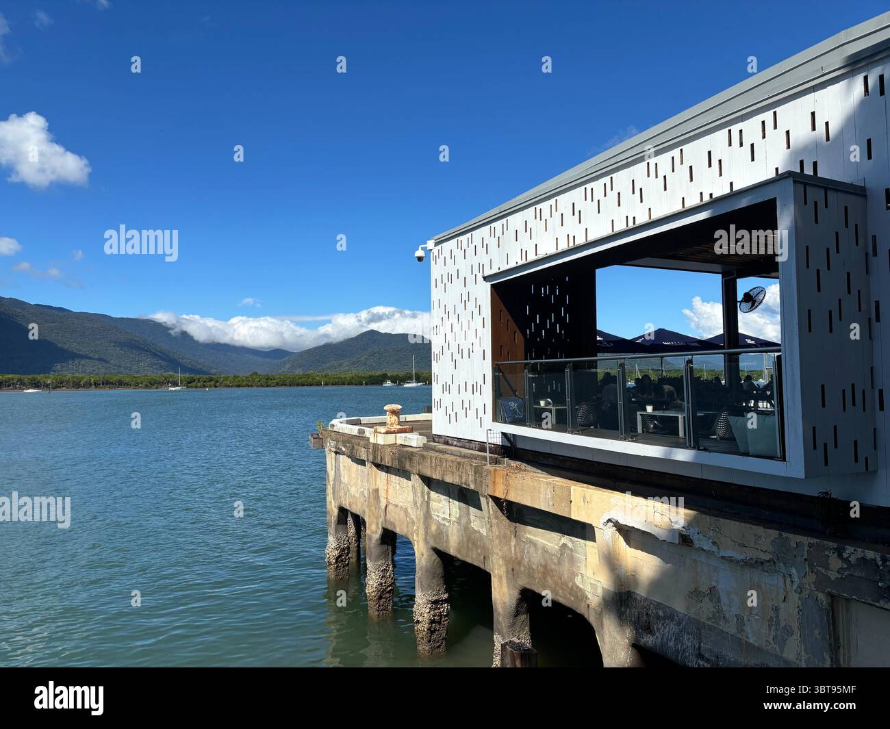 Wharf One Cafe and view over Trinity Inlet, Cairns, Queensland, Australia. No MR or PR - Smartphone Captured Stock Image