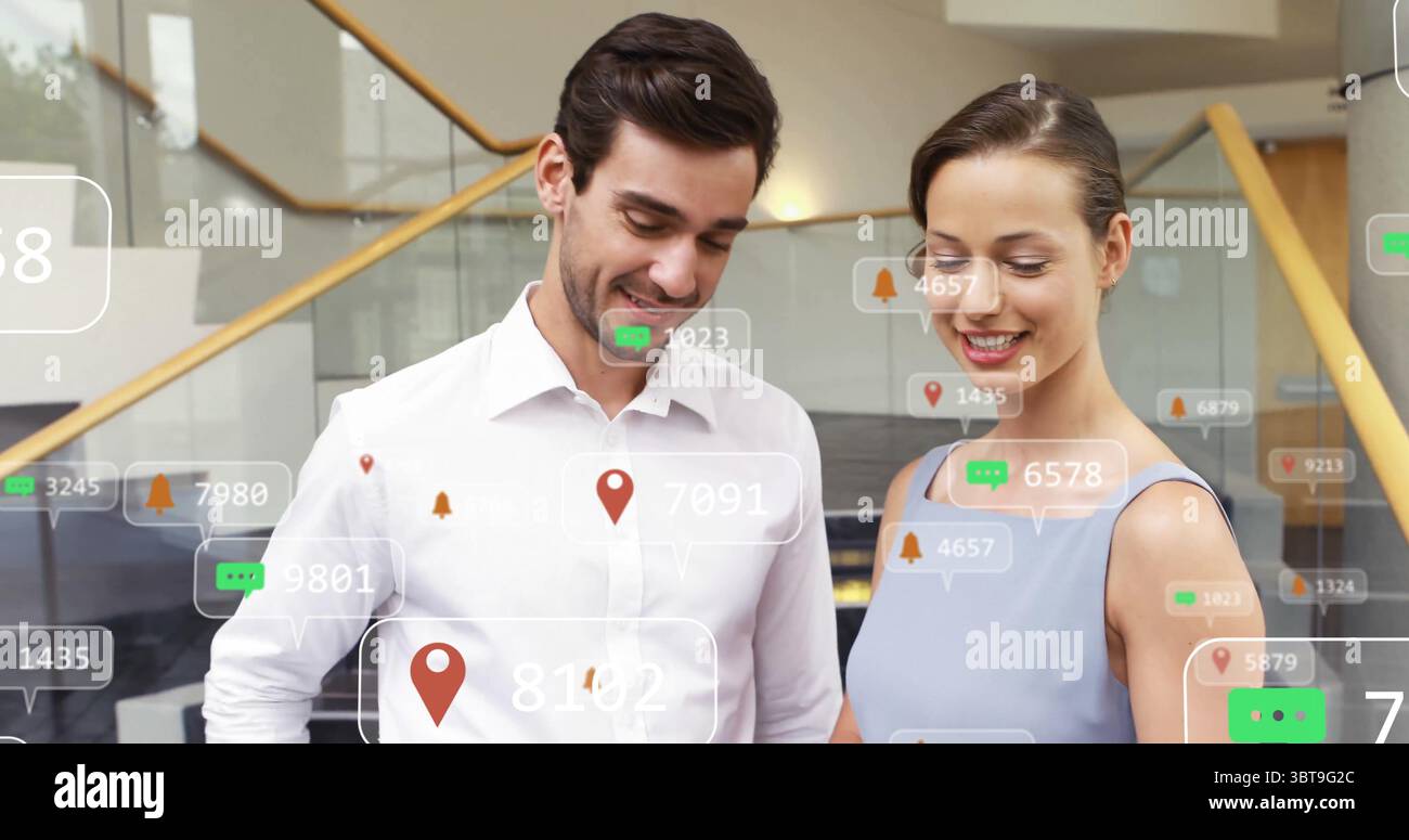 Reviewing digital overlays, colleagues in work attire standing in ...