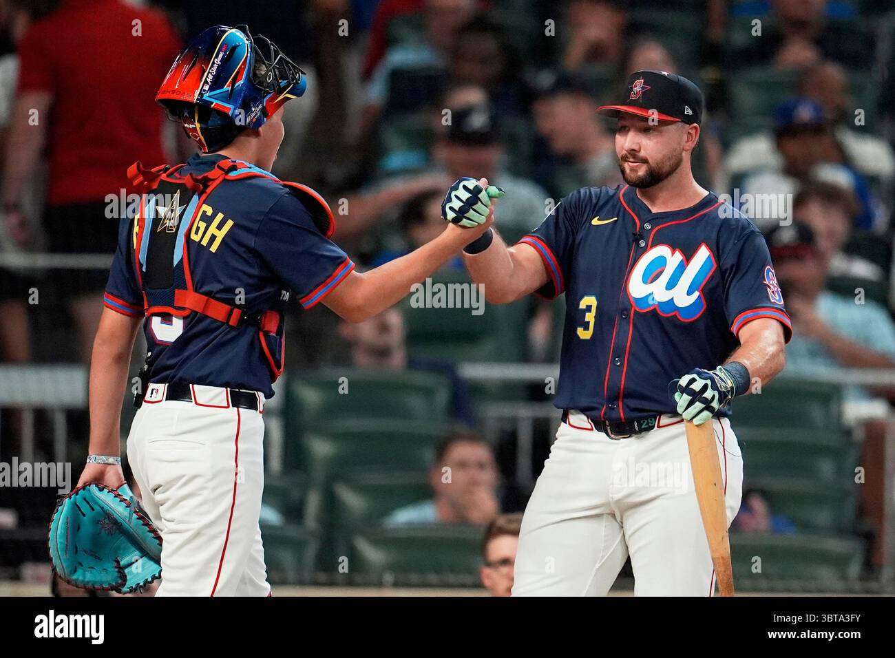 Seattle Mariners' Cal Raleigh greets his brother Todd Jr. during the ...
