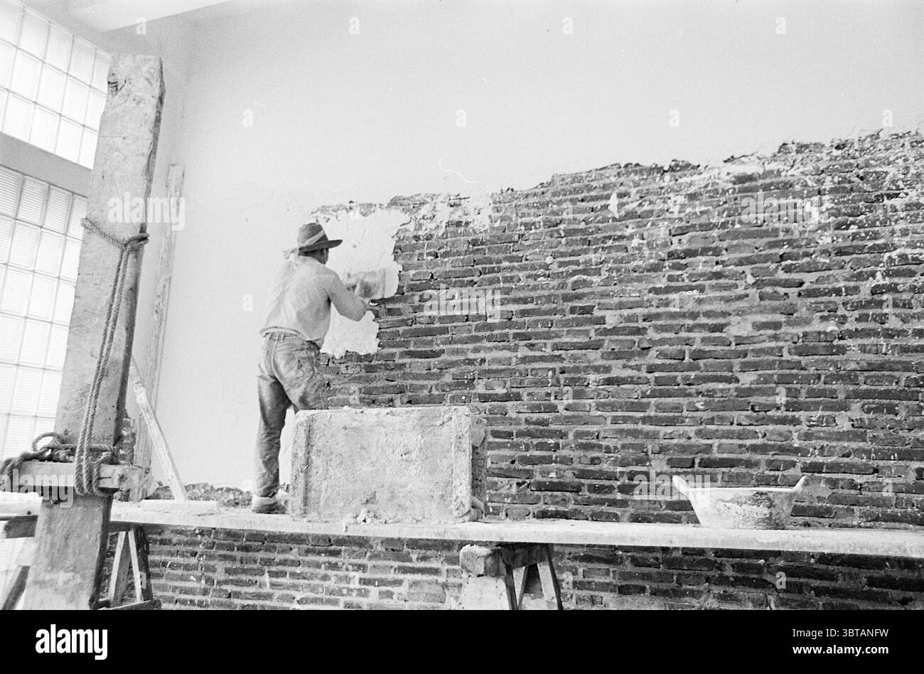 Worker plastering wall using Black and White Stock Photos & Images - Alamy
