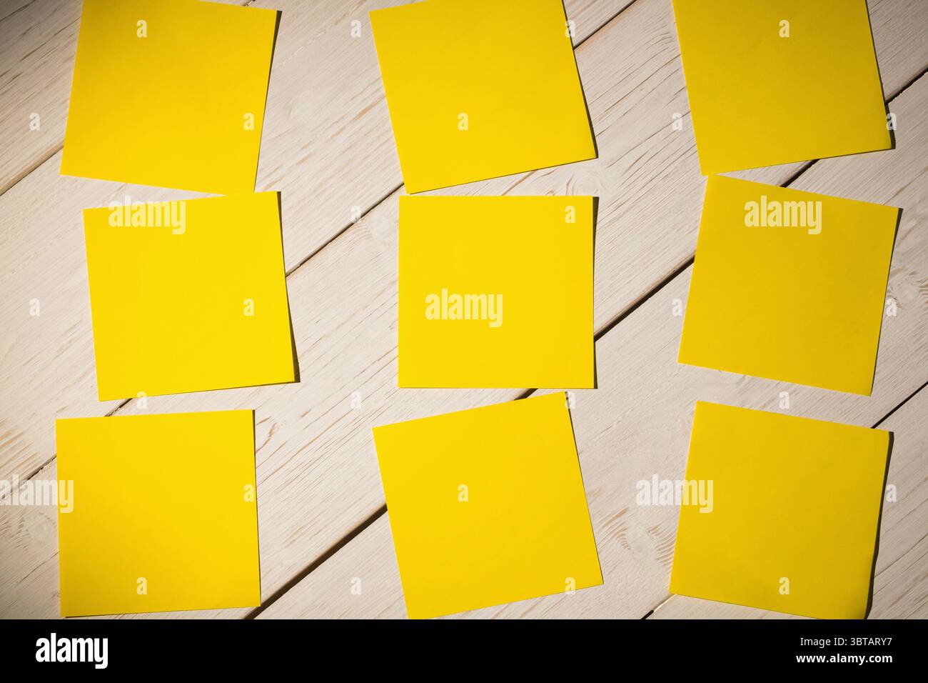 Yellow papers on wooden floor Stock Photo