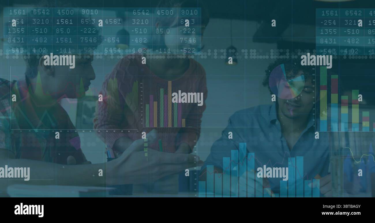 Collaborating data analysts interpreting analytics in modern office with laptop papers coffee mugs Stock Photo