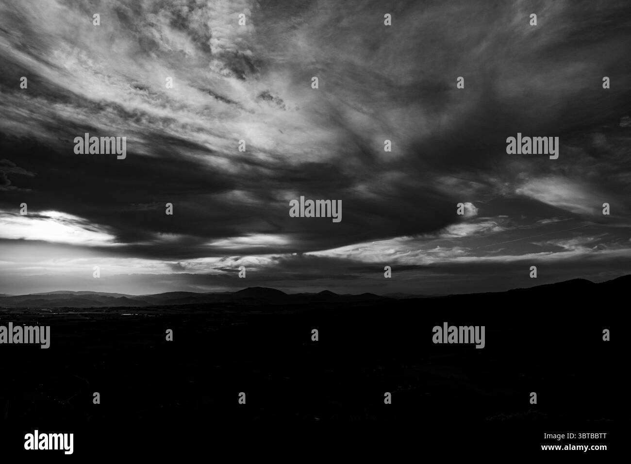 Dramatic Sky with Clouds in black and white in the Assisi hills Stock ...