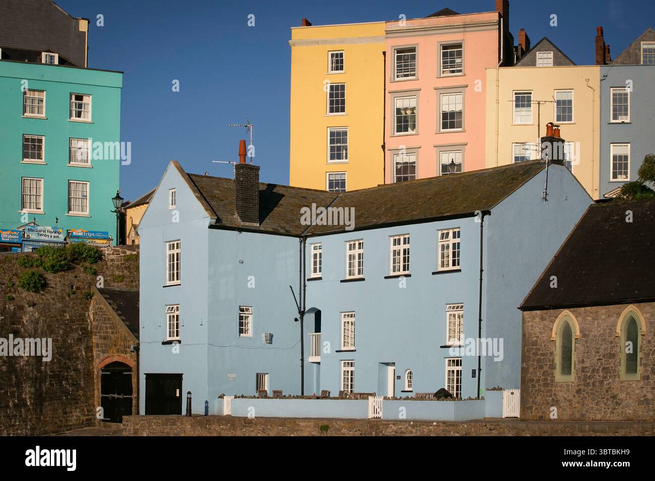 Editorial Tenby, UK - July 09, 2025: The colourful Georgian houses in the harbour town of Tenby, Pembrokeshire, South Wales Stock Photo