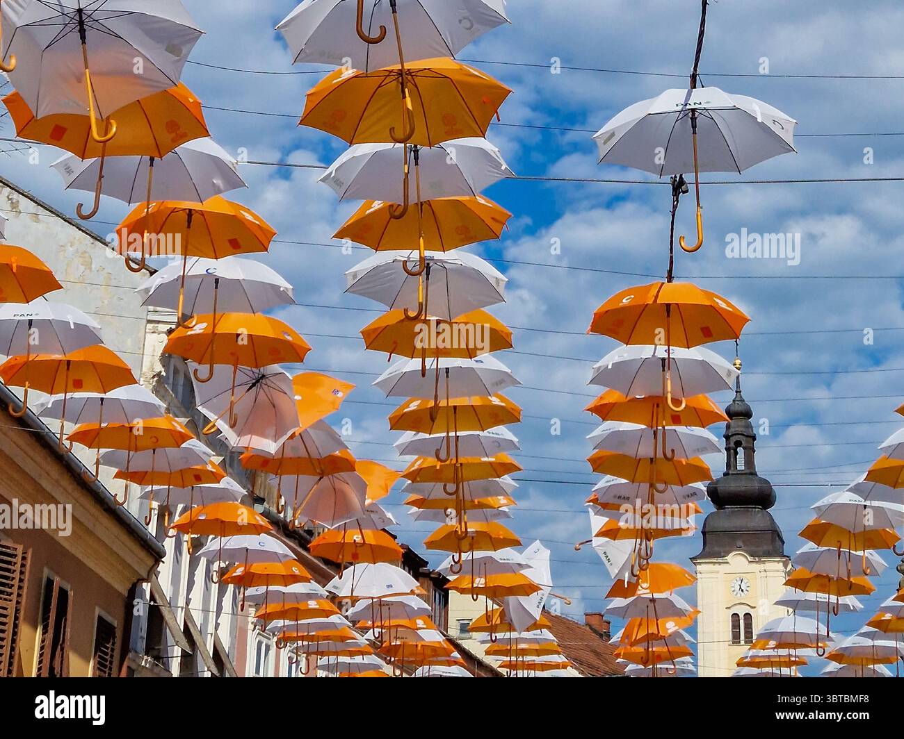 Different colours hanging umbrellas on Porcijunkulovo 2022 Stock Photo