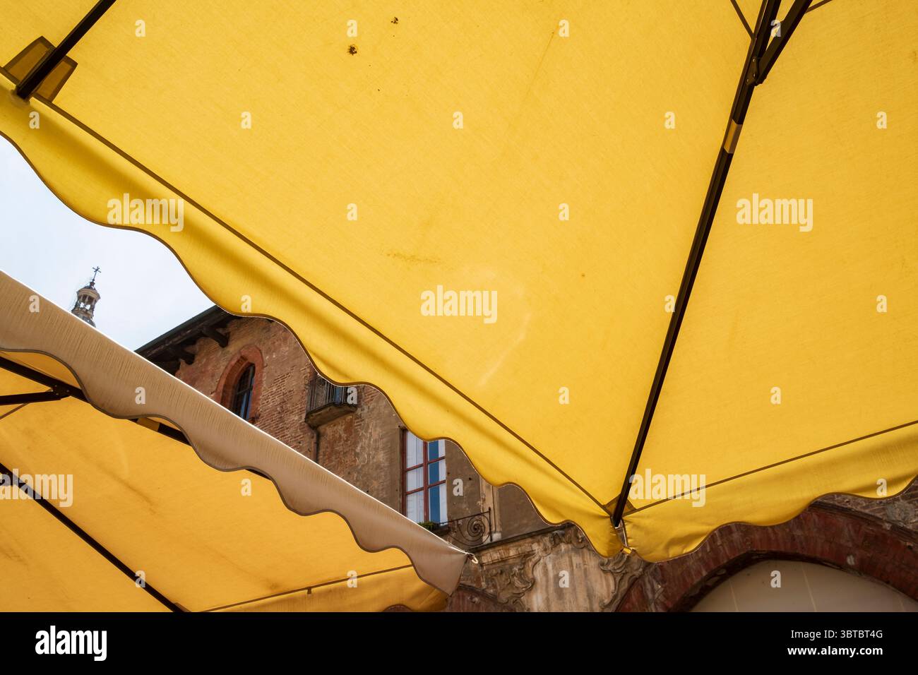 Bar umbrellas at Piazza della Vittoria, Pavia, Italy Stock Photo
