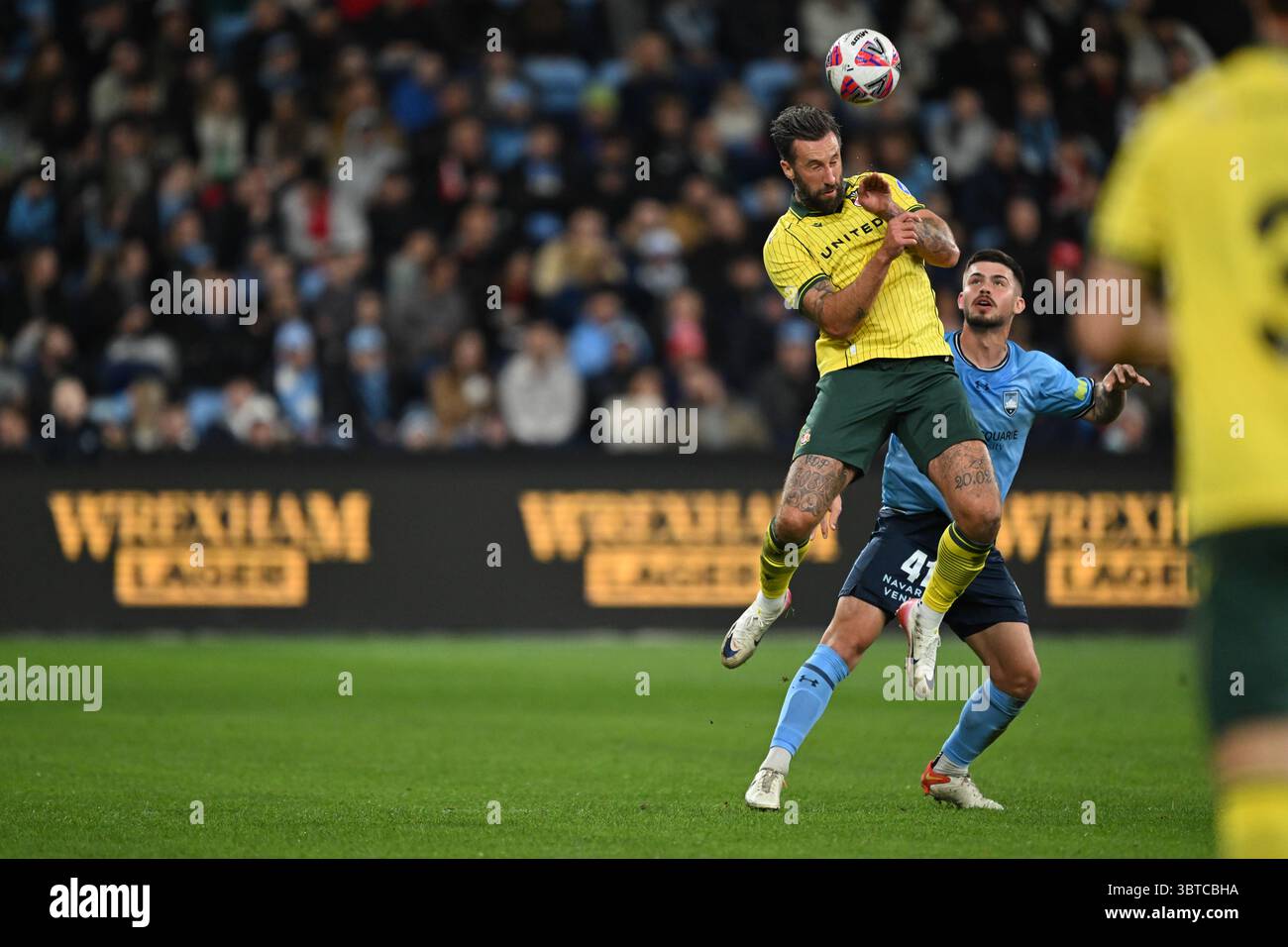 Sydney, Australia. 15th July, 2025. Ollie Palmer of Wrexham heads the ...