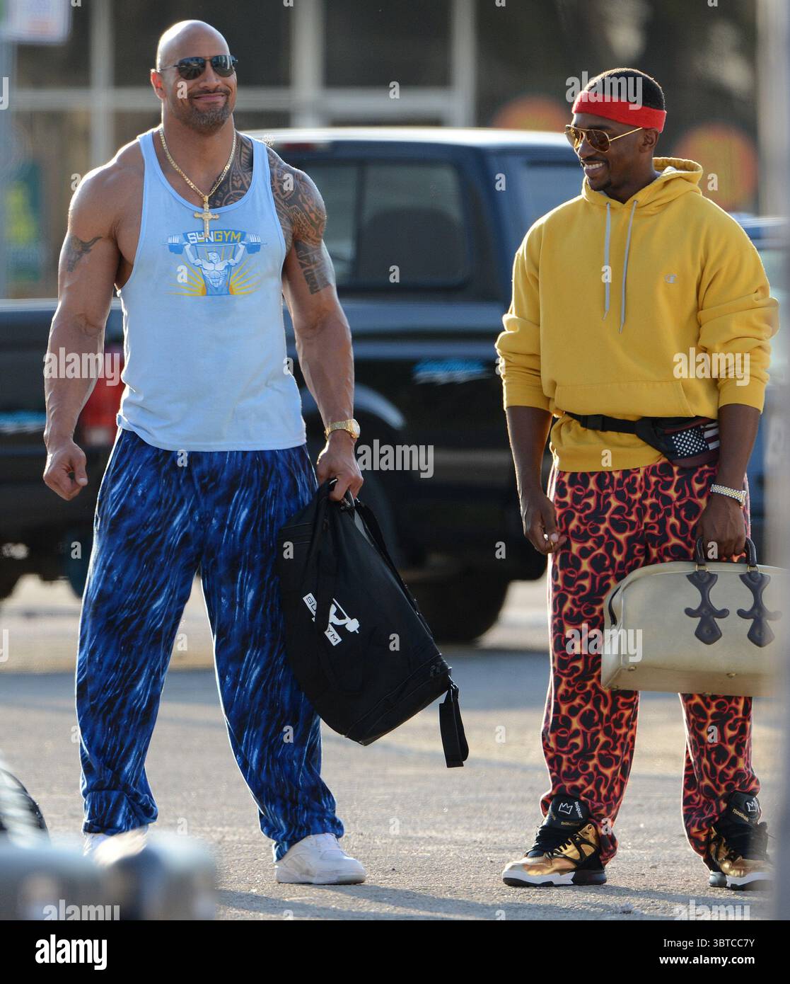 MIAMI , FL - APRIL 04:   Dwayne Johnson Anthony Mackie on the set of Pain and Gain which is directed by Michael Bay. Pain and Gain is about a  pair of bodybuilders in Florida get caught up in an extortion ring and a kidnapping scheme that goes terribly wrong. on April 4, 2012 in Miami Beach, Florida....People:  Dwayne Johnson Anthony Mackie. (Credit Image: © SMG via ZUMA Wire) Stock Photo