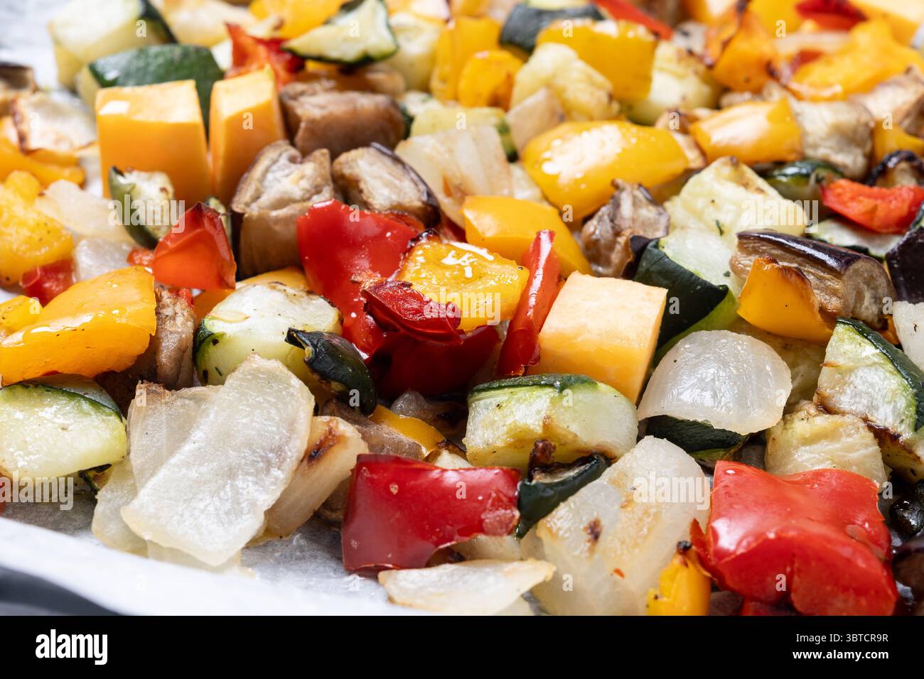 Roasted vegetables isolated on white background Stock Photo