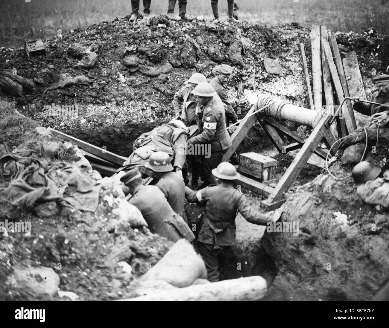 Battle of Cambrai . German prisoners hauling up wounded from an advanced dressing station dug out by windlass .  51st Division  1917 Stock Photo