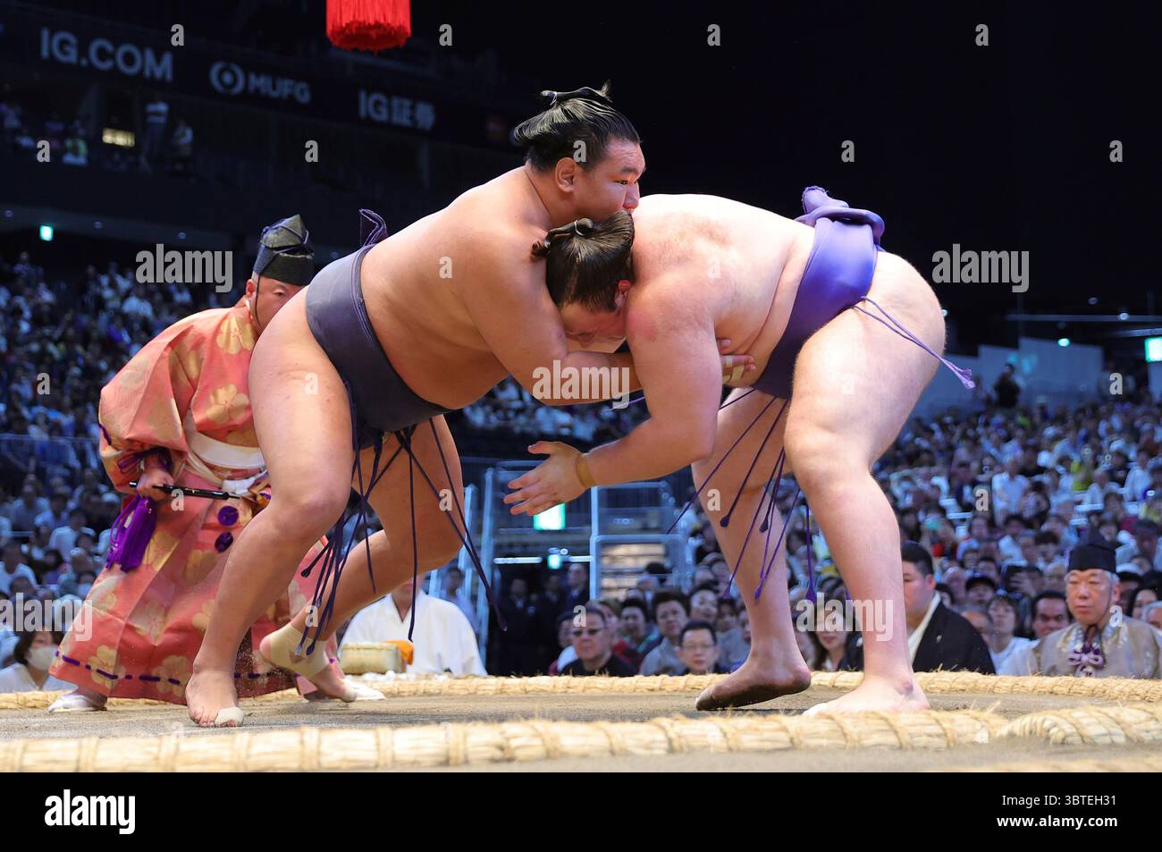 Yokozuna Hoshoryu of Mongolia (L) is defeated by East Maegashira No.1 ...