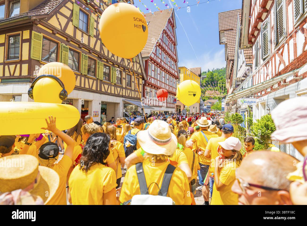 Colourful balloons above a crowd at a celebration, 950 years Calw ...