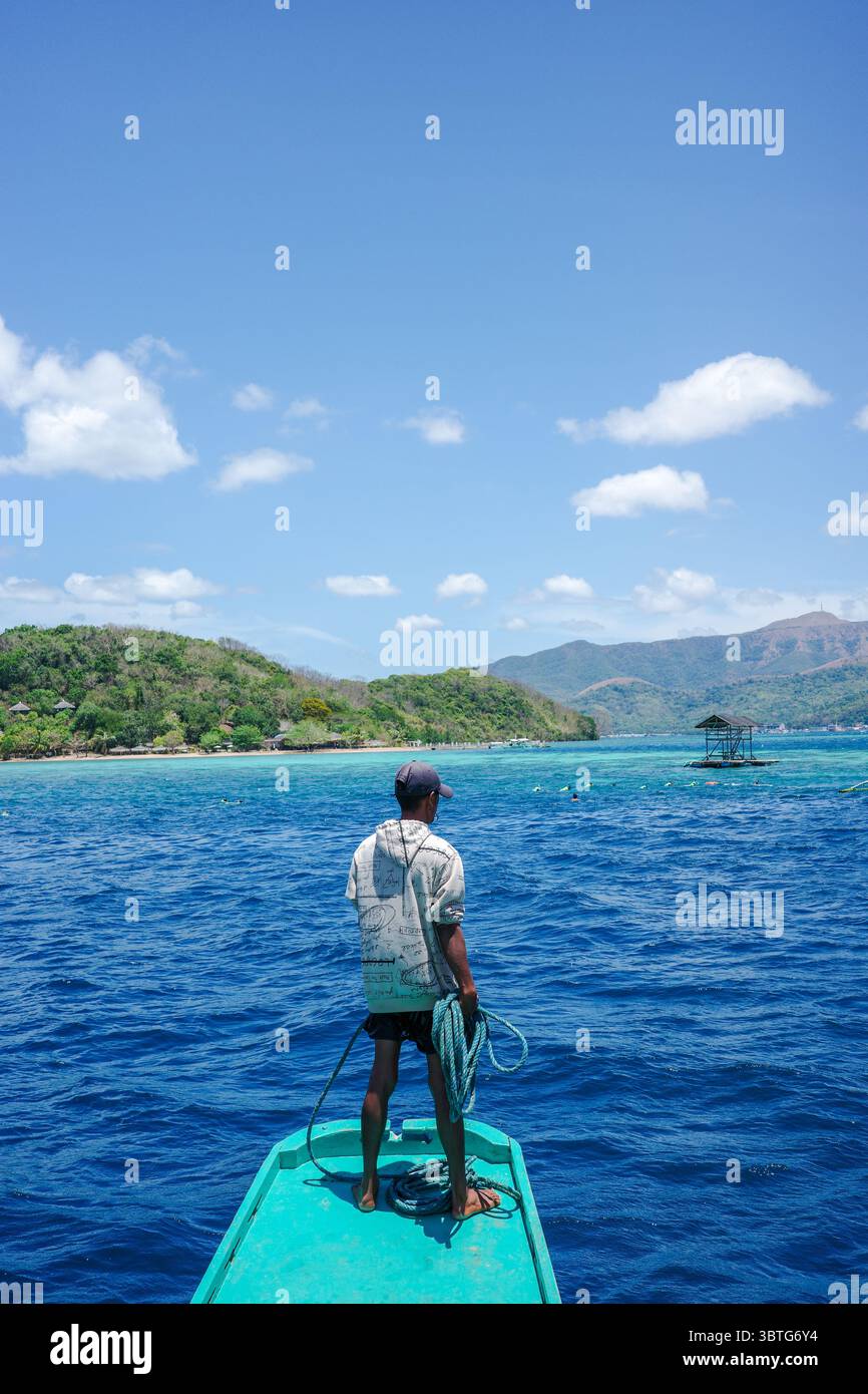 Fisherman try to park ferry boat on a diving spot with beautiful ...
