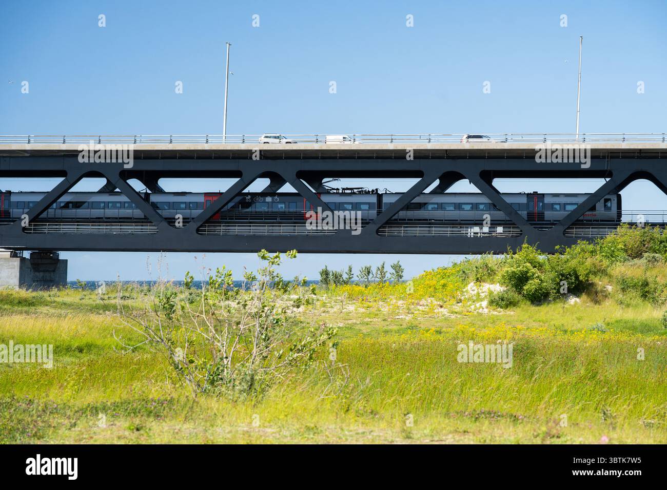 Train travelling on the lower level of the Oresund bridge which connects Copenhagen (Denmark) and Malmo (Sweden) - cars and buses use the top level Stock Photo