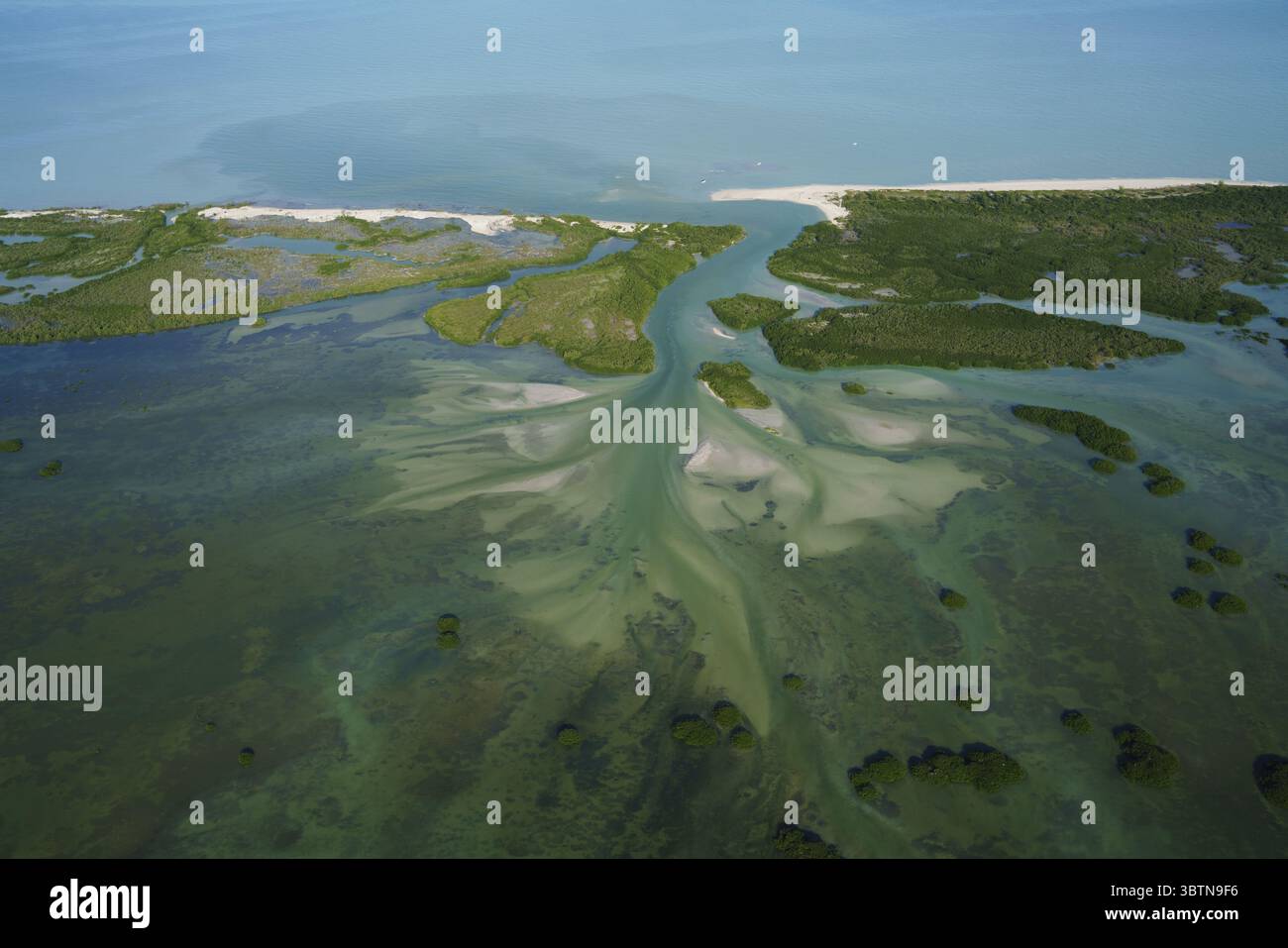 Aerial view of the estuary where the river meets the sea, creating a ...