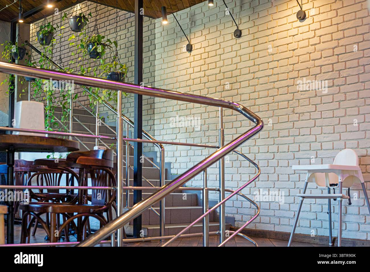 cozy modern interior design with flowers in a cafe Stock Photo - Alamy