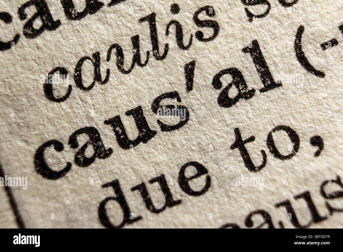 Word causal on dictionary page, macro close-up Stock Photo
