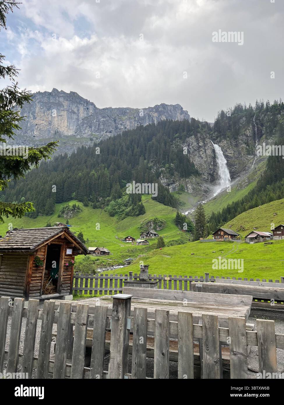 Traditional Houses Near Uri Waterfall in Altdorf, Switzerland – Scenic Mountain Landscape in the Swiss Alps. - Smartphone Captured Stock Image