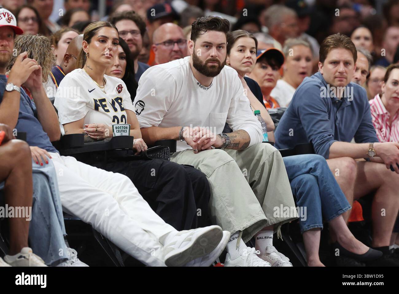 Boston Red Sox pitcher Lucas Giolito, center, attends a WNBA basketball