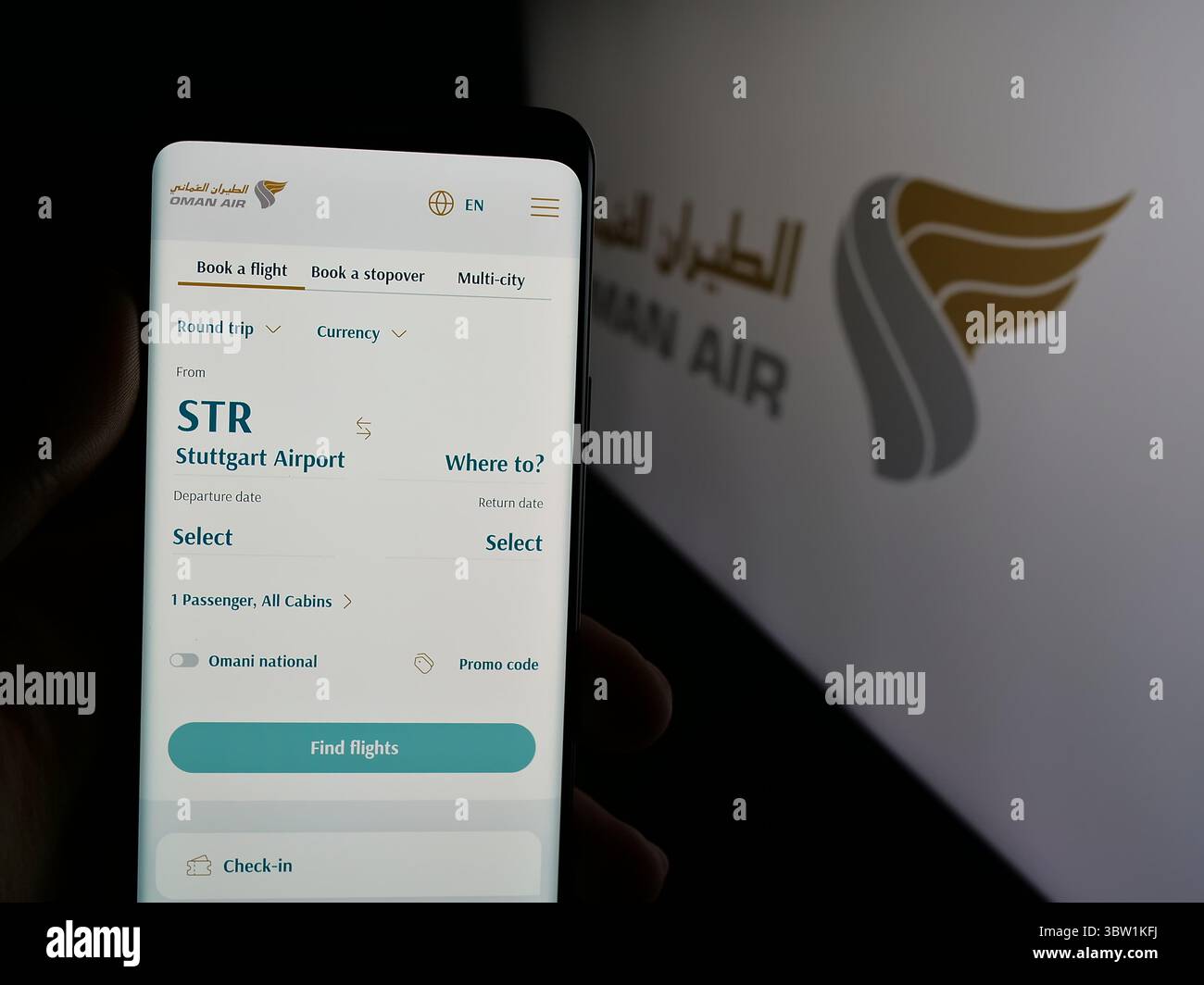 Germany. 19th June, 2025. In this photo illustration, a person is holding a smartphone with the webpage of airline company Oman Air on screen in front of logo. (Photo by Timon Schneider/SOPA Images/Sipa USA) *** Strictly for editorial news purposes only *** Credit: Sipa USA/Alamy Live News Stock Photo