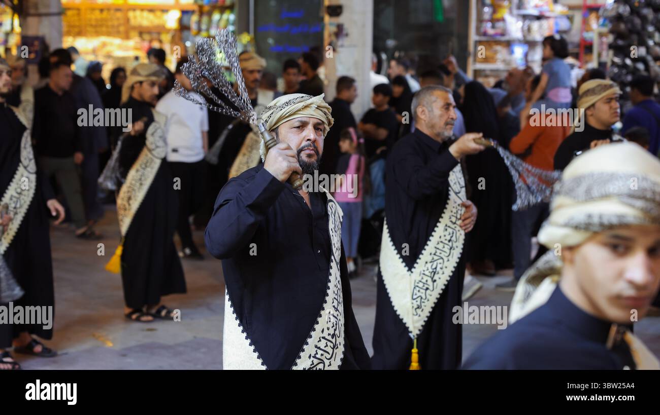 Iraq Commiunity Men dressed in traditional attire participate in a cultural celebration ...