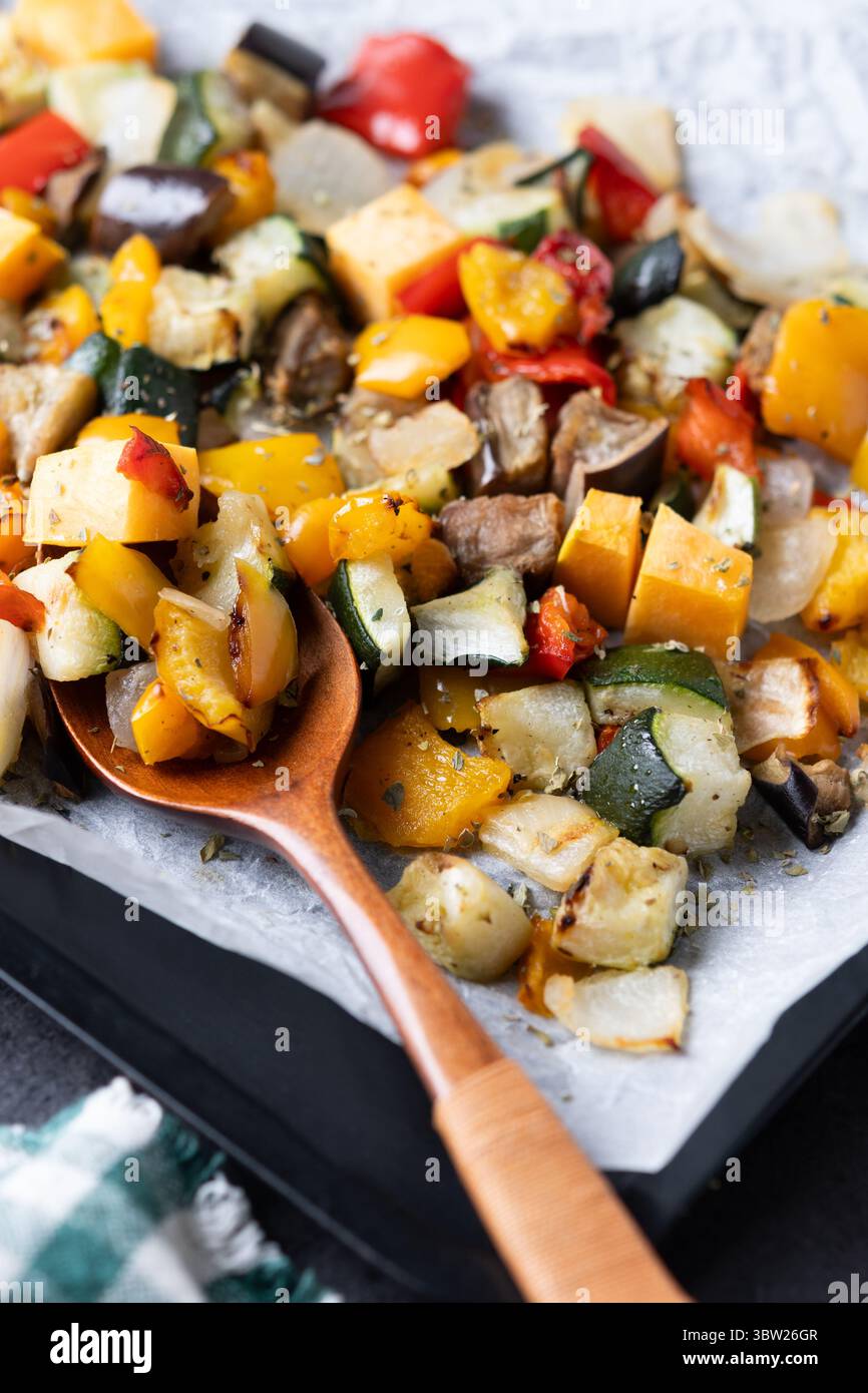 Roasted vegetabes on black slate background Stock Photo