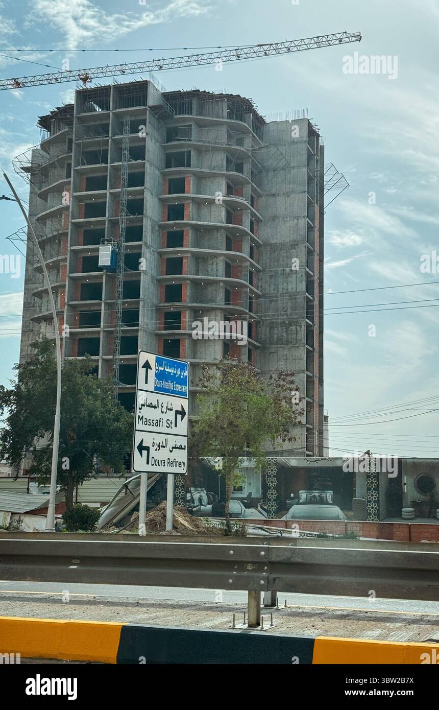A construction site displays a tall building nearing completion in ...