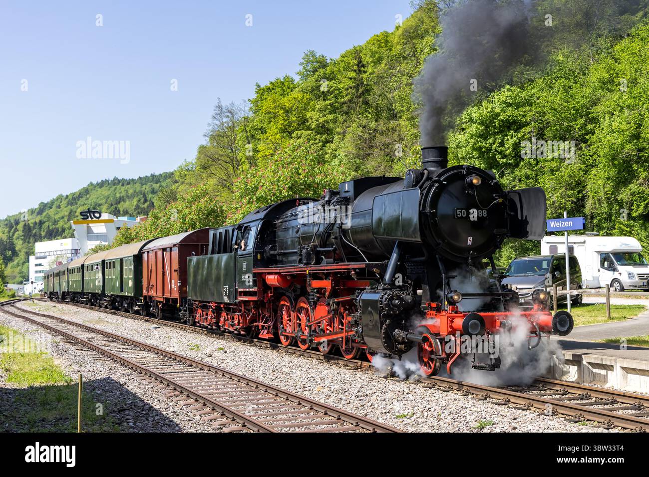 Weizen, Germany - May 2, 2025: Sauschwänzlebahn steam train locomotive at Epfenhofen railway station in Weizen, Germany. Stock Photo