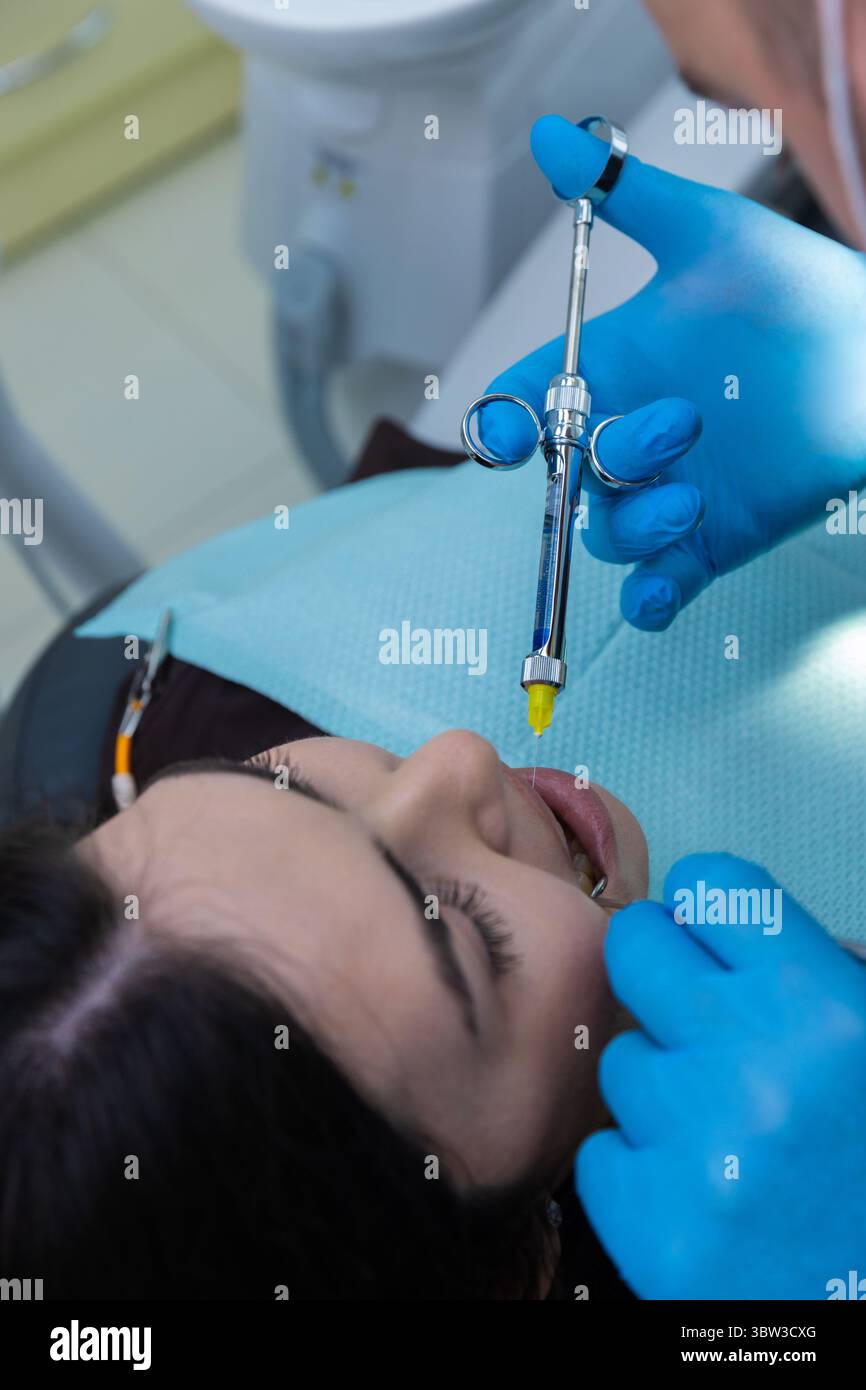 Dental Procedure Visual: Patient Undergoing Anesthesia with a Syringe ...