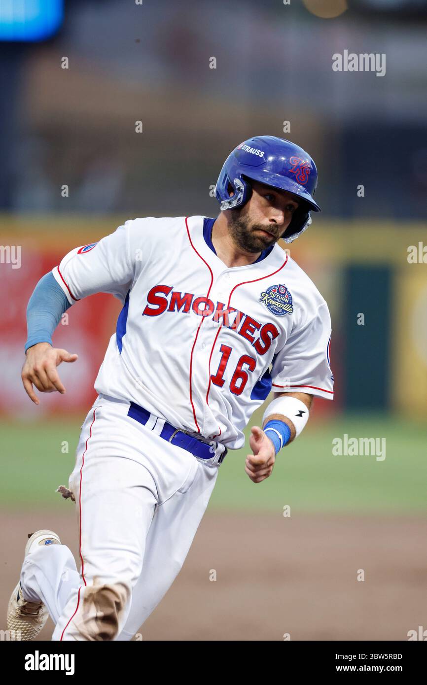 Knoxville Smokies catcher Casey Opitz (16) hustles to third base ...