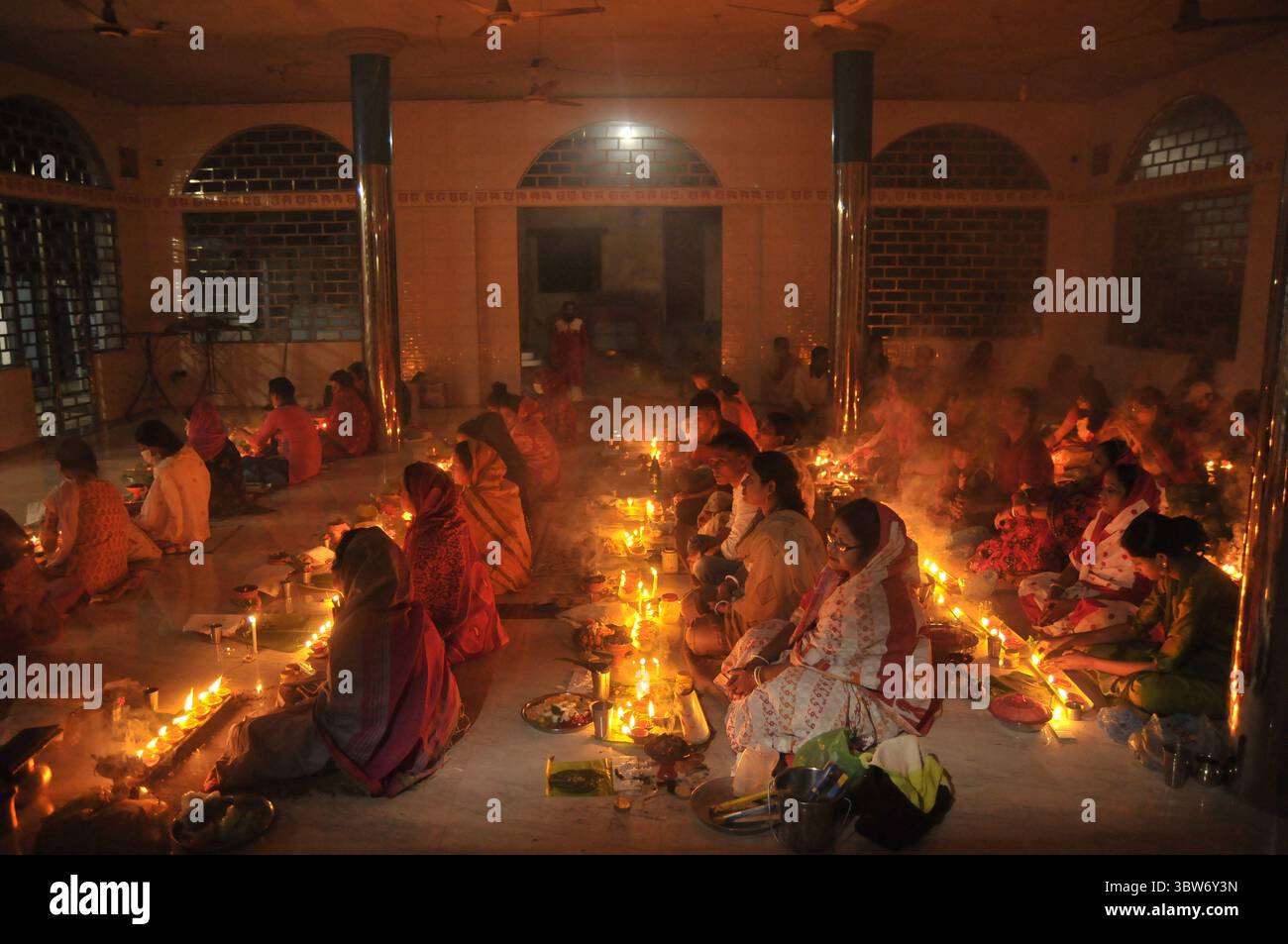 November 10, 2020: Under the Shadow of Corona Virus, Hindu devotees sit together on the floor at Sri Sri Loknath Brommochari  babar Ashrom and Mondir temple to observe Rakher Upabash ritulas, in Korer Para, Sylhet, Bangladesh. (Credit Image: © Md Rafayat Haque Khan/ZUMA Wire) Stock Photo