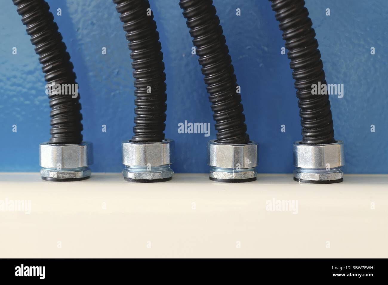 The new electrical wires in the corrugated protection are attached to ...