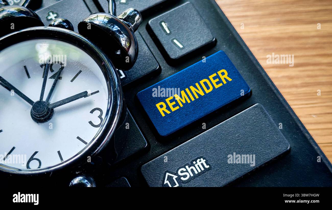 Reminder Button on Keyboard with Alarm Clock Stock Photo