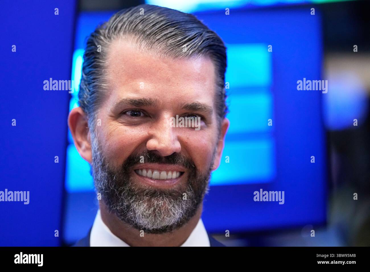 Donald Trump, Jr. smiles on the floor at the New York Stock Exchange in