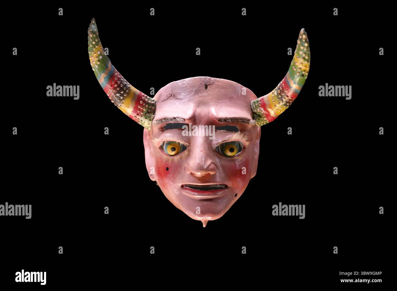 Traditional Andean devil mask with colorful horns used in indigenous festivals and rituals in Peru, Bolivia, and Ecuador. Stock Photo