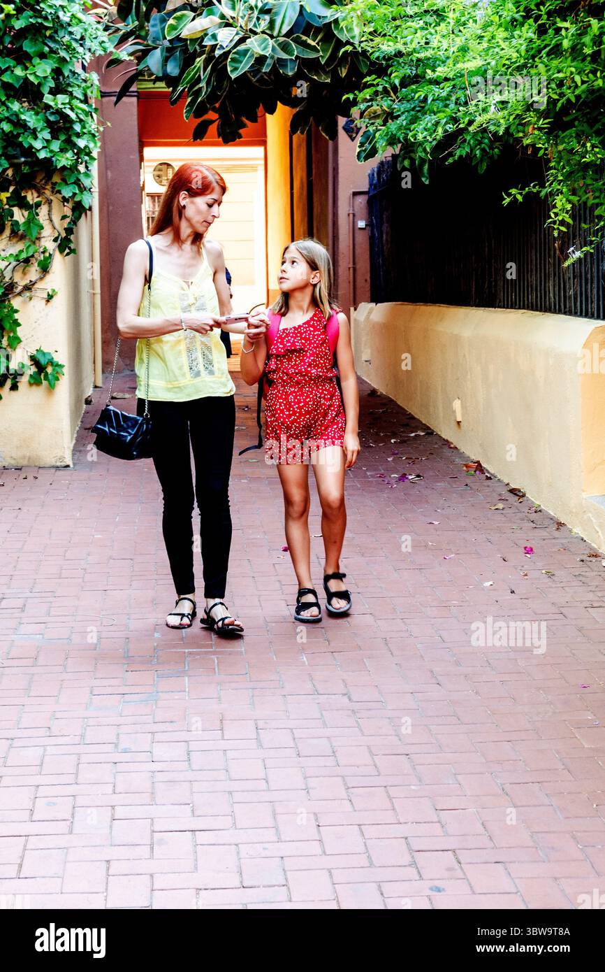 Mother giving instructions to her daughter before school Stock Photo ...