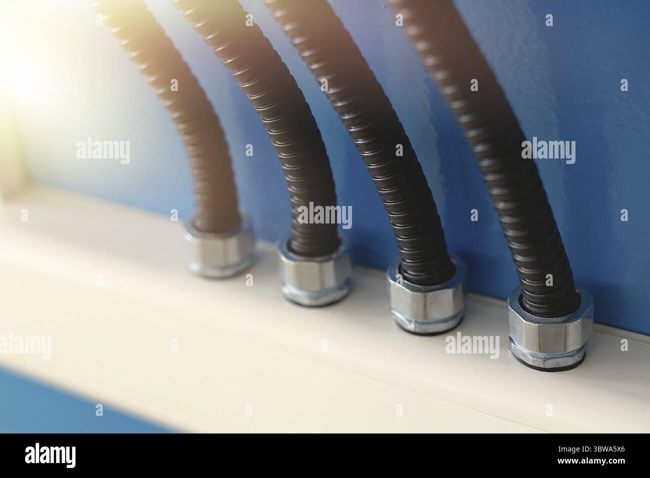 The electrical wires in the corrugated protection are attached to the ...