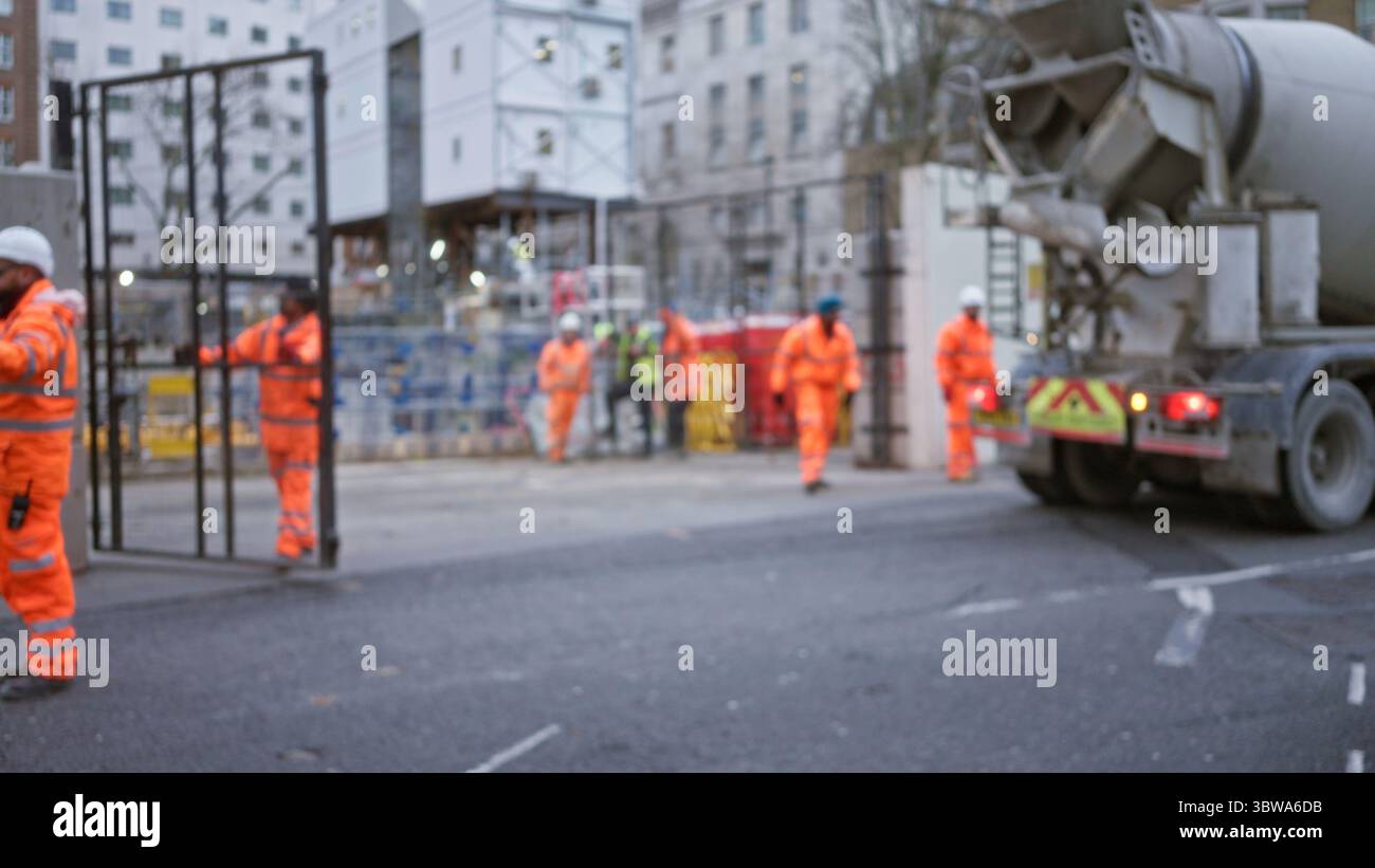 Construction workers in orange uniforms hi-res stock photography and ...
