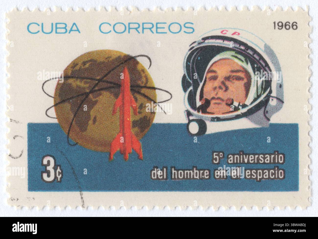 CUBA - 1966 April 12: 3 centavo multicolored postage stamp depicting Yuri Gagarin in space helmet, Rocket, Earth and Orbits. First Man in Space, 5th Anniversary Stock Photo