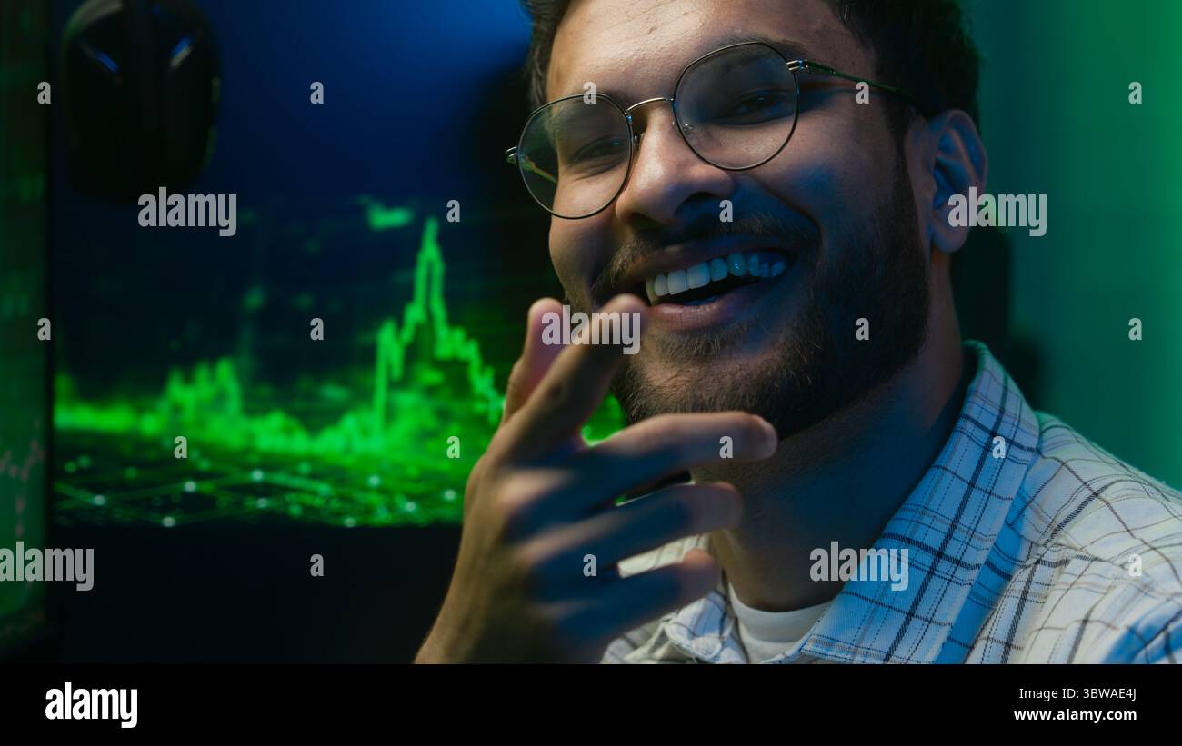 Thoughtful pensive Arabian Indian man thinking pondering solution programmer coder hacker worker cyberspace analysis male guy puzzled trader broker Stock Photo