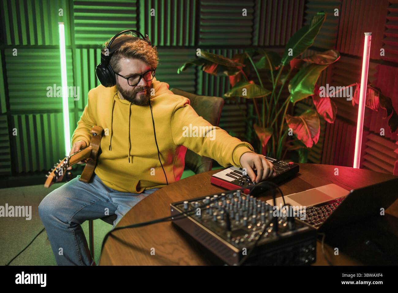 Sound engineer working at mixing panel in the boutique recording studio ...