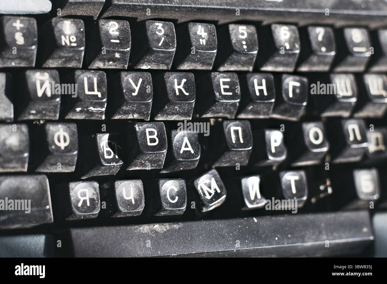 Outdated typewriter close-up. Broken keyboard with Russian letters. Background Stock Photo